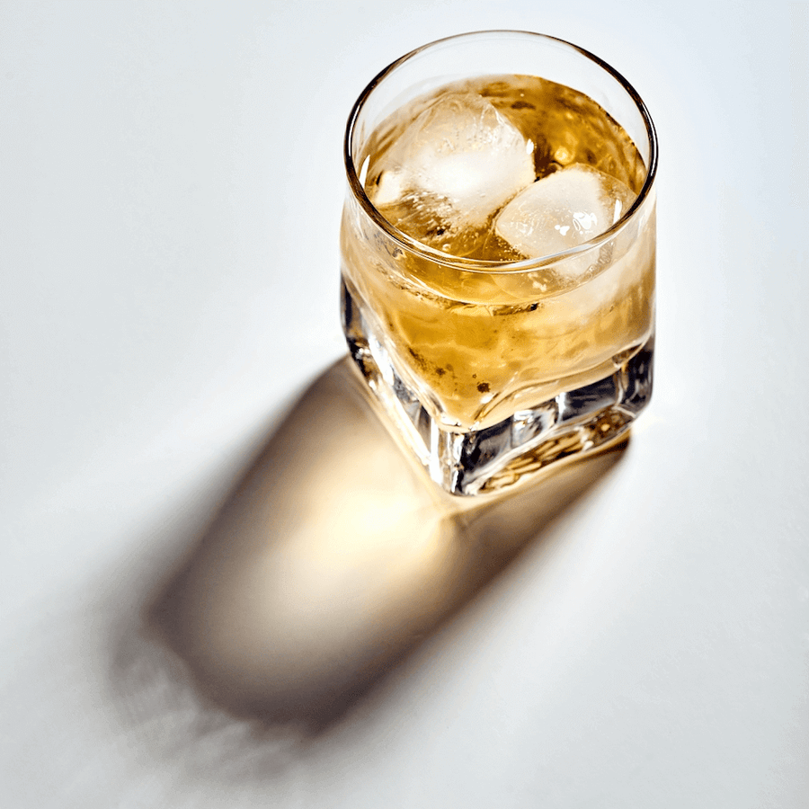 Glass of whisky with ice