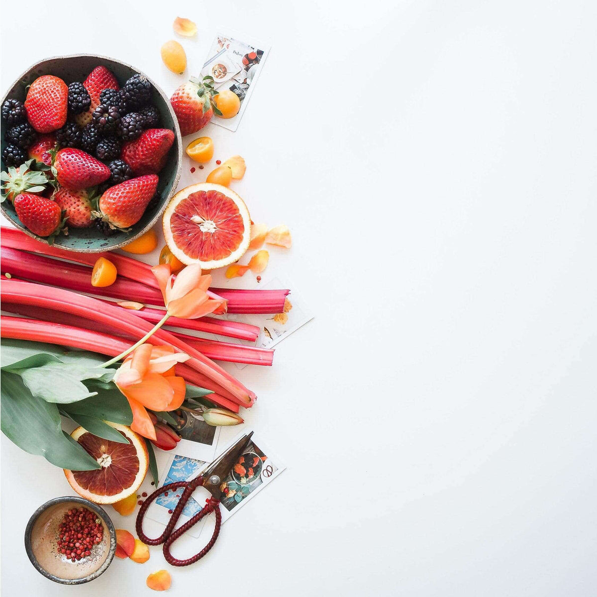Fresh fruit and rhubarb on a white table