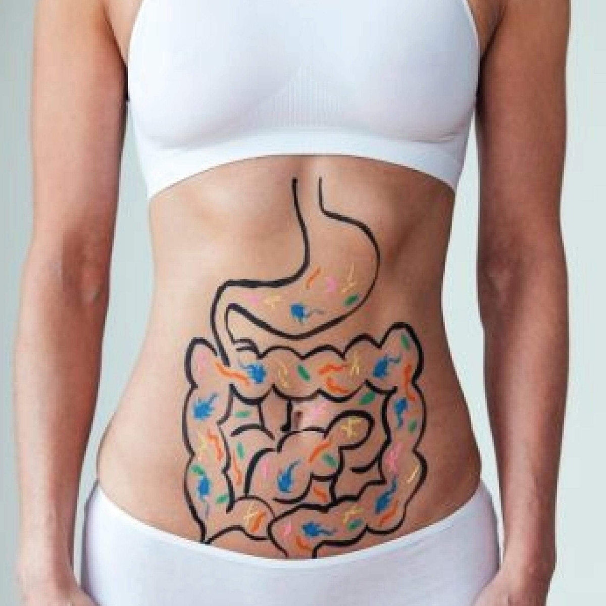 Illustration of the digestive system drawn on a woman's stomach