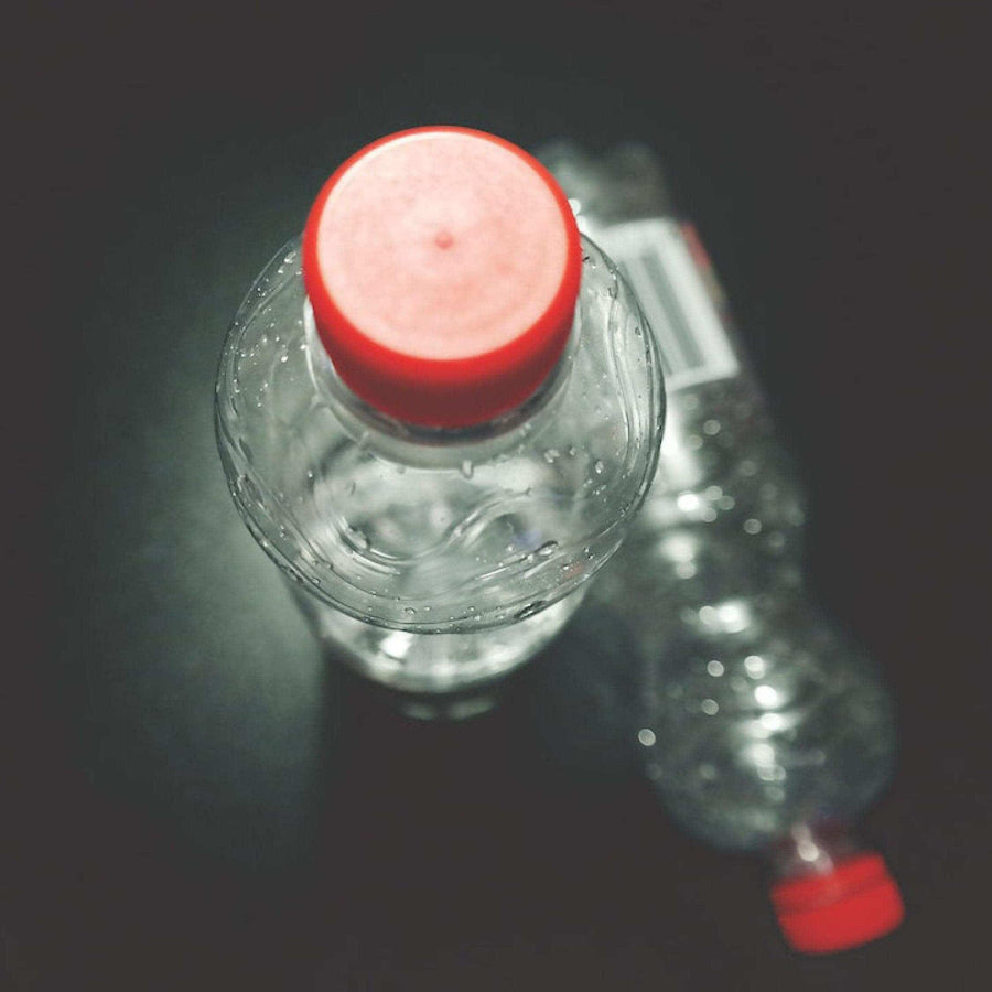 Plastic water bottle on a dark background