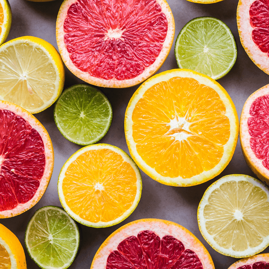 Halved grapefruit, oranges, lemons and limes