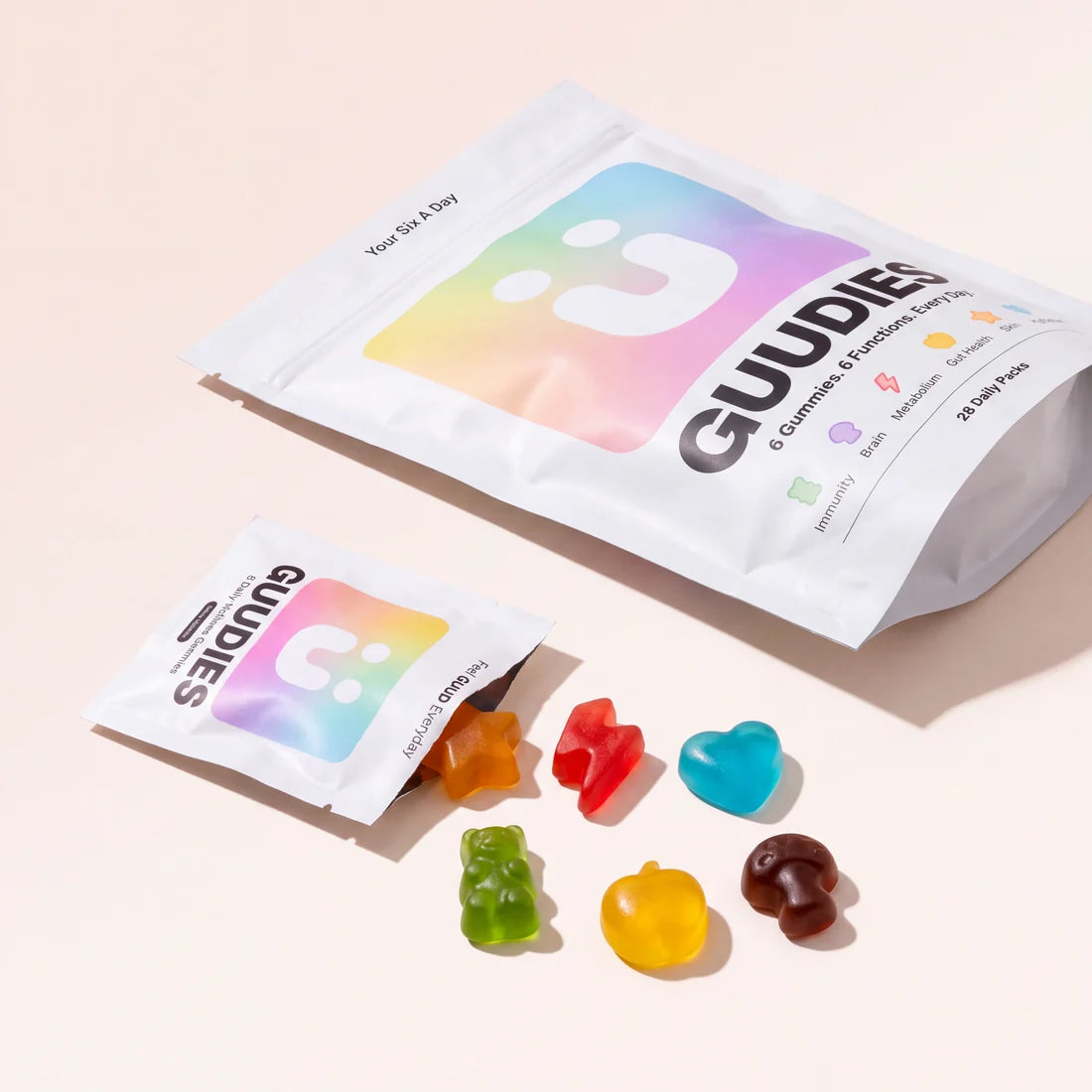 GUUDIES 1 Month Supply pouch with colourful gummies spilling out beside it